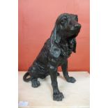 A bronze figure of a seated spaniel, 36cms h