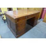 A Victorian style mahogany leather topped library desk