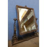 A 19th Century French copper dressing table mirror, 79cms h
