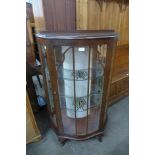 A walnut display cabinet