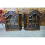 A pair of Dutch oak wall hanging cabinets
