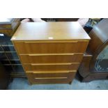 A teak chest of drawers