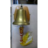 A brass wall mounted bell