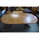 A Danish teak extending dining table