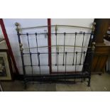 A Victorian style brass and steel double bed