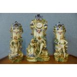 A continental bisque porcelain quartz clock garniture