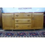 An Ercol Blonde elm Windsor sideboard