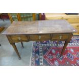A George III oak three drawer side table