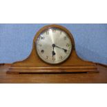 A walnut mantel clock, glass cracked