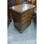 A small mahogany chest of drawers