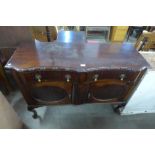 A mahogany serpentine sideboard