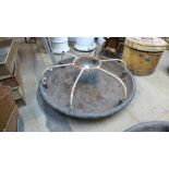 A cast iron Mexican hat pig feeder