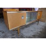 A walnut cocktail sideboard