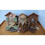 Three cuckoo clocks