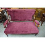 A Victorian mahogany and upholstered salon settee