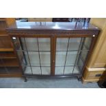 A mahogany two door bow front display cabinet