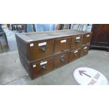 Two sets of four oak index drawers