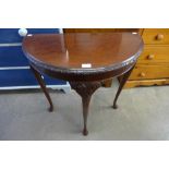 A mahogany demi lune hall table