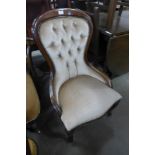 A Victorian style mahogany and upholstered nursing chair