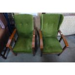 A pair of 1930's beech and upholstered reclining fireside chairs