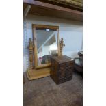 A small three drawer table top chest and a pine toilet mirror