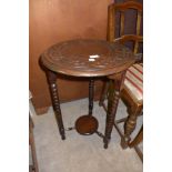 A carved oak occasional table