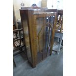 A walnut display cabinet