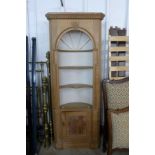 A pine architectural freestanding corner cabinet