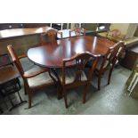 A Regency style mahogany pedestal dining table and six Hepplewhite style chairs
