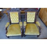 A pair of Victorian carved oak and upholstered open armchairs, one a/f