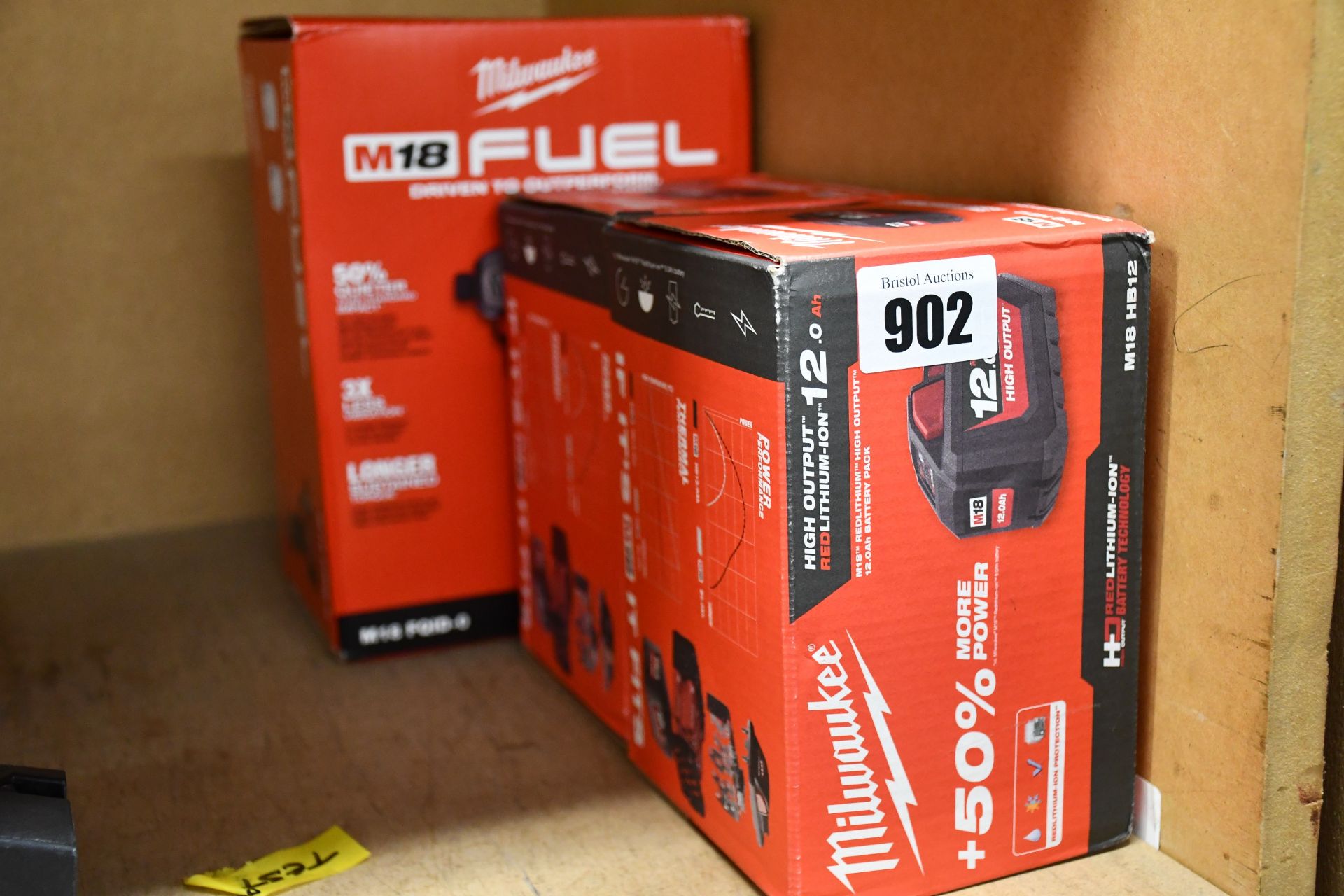 A boxed as new Milwaukee Impact Driver (M18 FQID-0) and two Milwaukee batteries (M18 HB12).