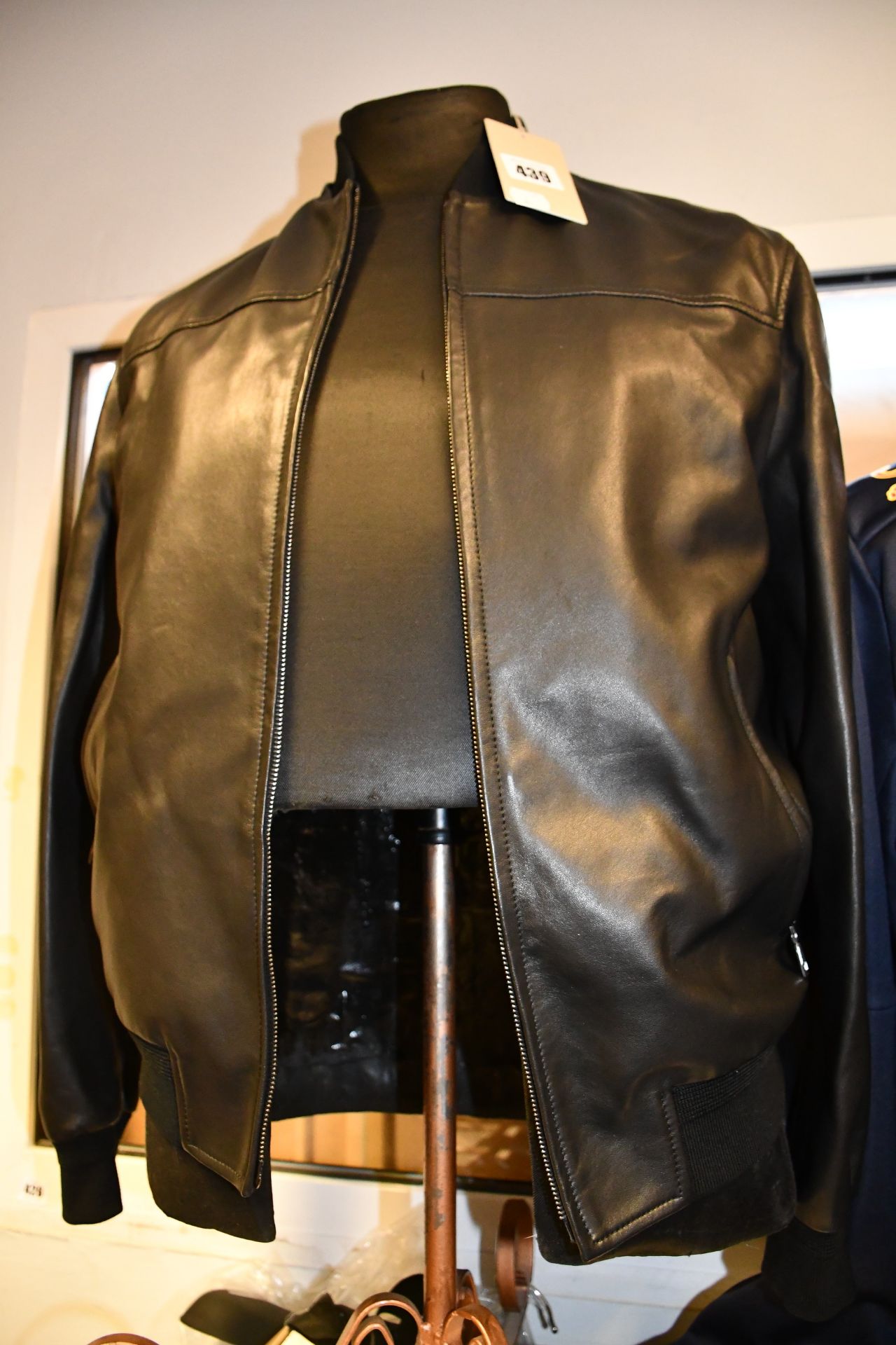 An as new Brioni bomber jacket in black (48 - RRP £1,075).