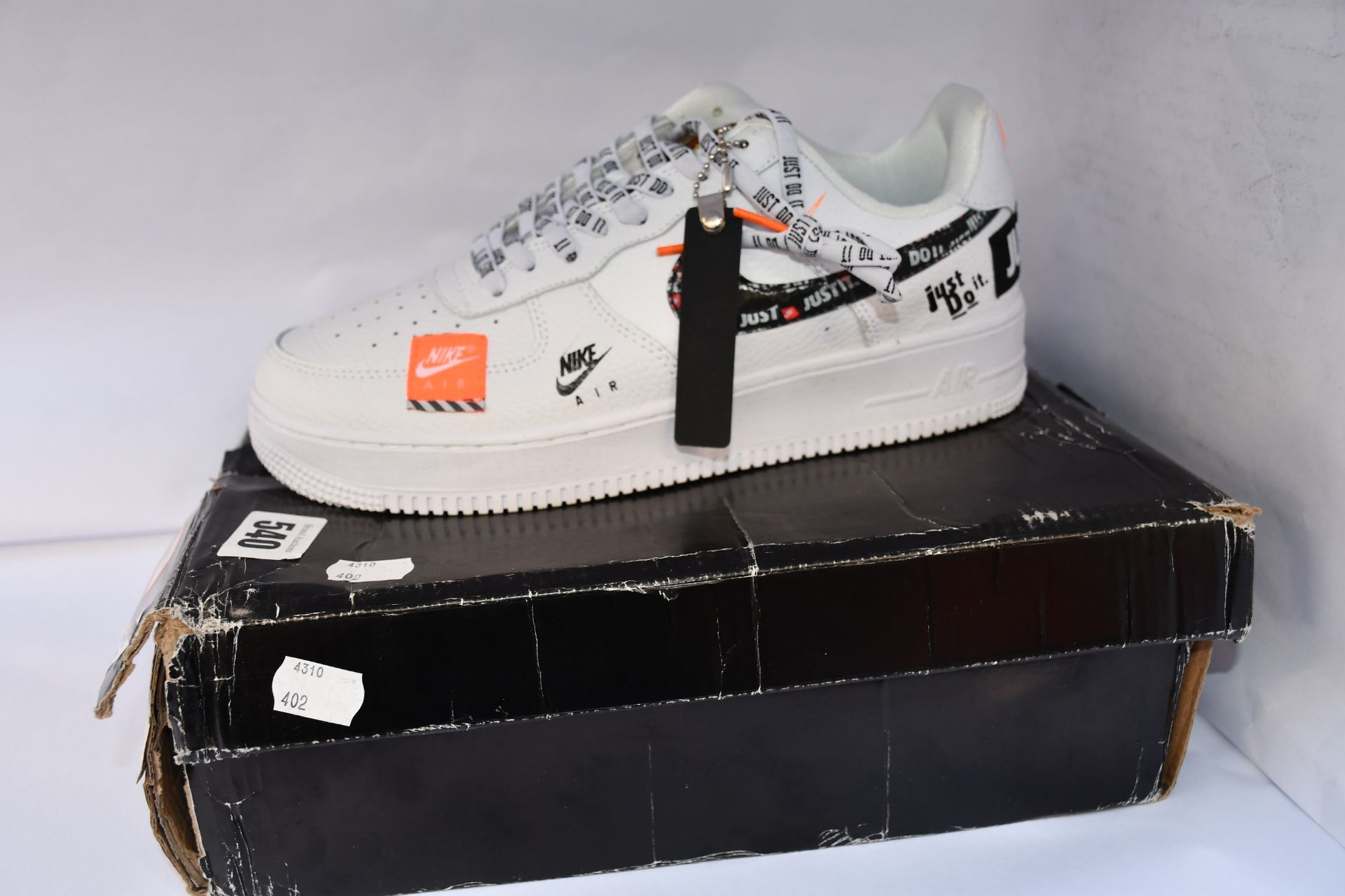 A pair of as new Nike Air Force 1 Just Do It Premium trainers (UK 8.5).