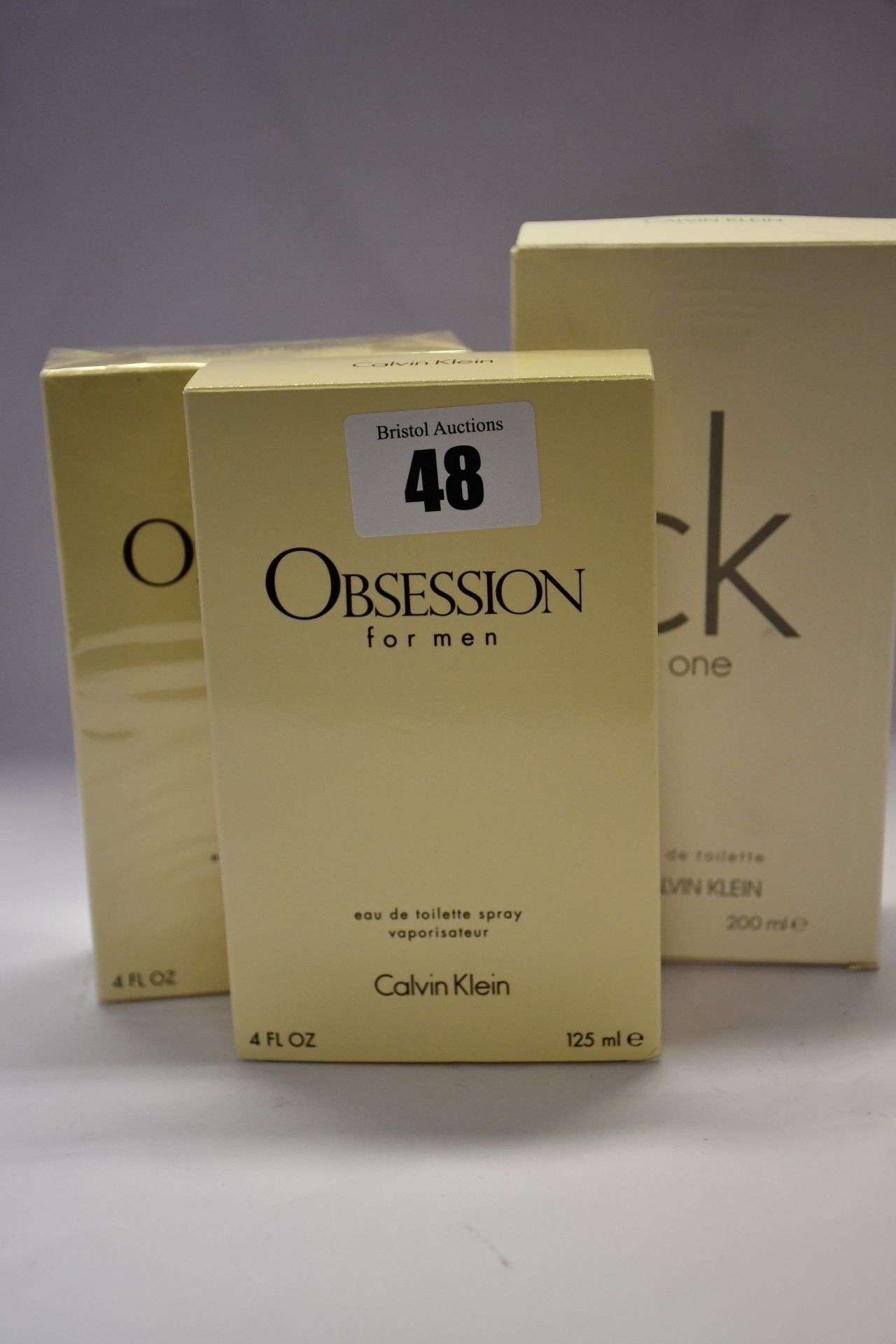 Three Calvin Klein One eau de toilette (200ml) and three Calvin Klein Obsession eau de toilette (