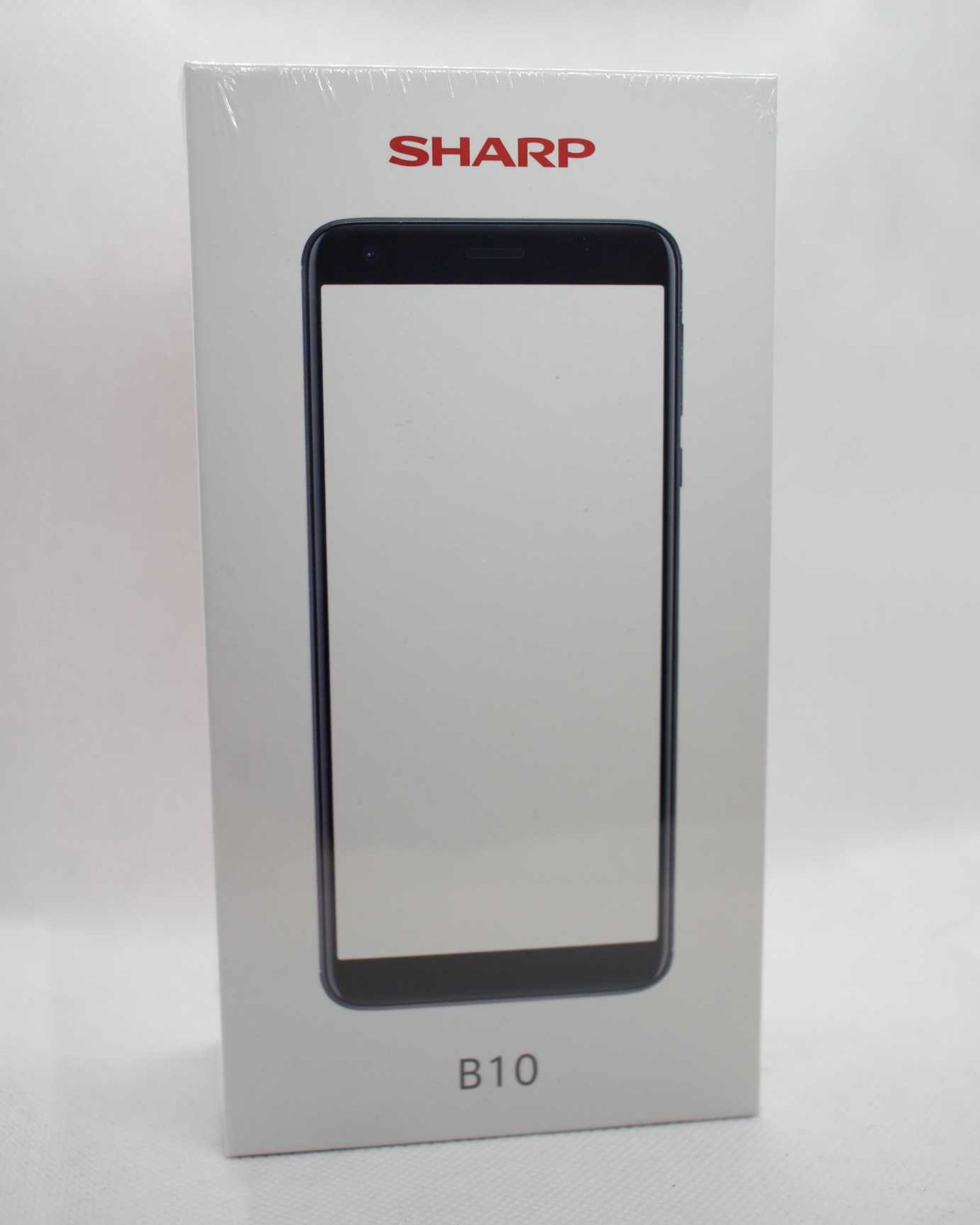 A boxed as new Sharp B10 3/32 in Black. Note -requires UK USB charger. Please check your mobile