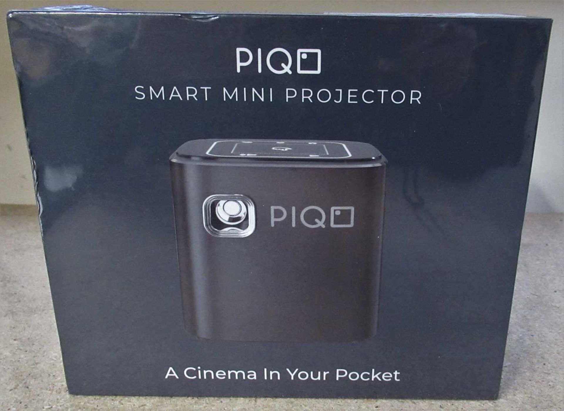 A boxed as new Piqo Smart Mini Projector. Powered by Android. Works with Apple AirPlay. Aux,