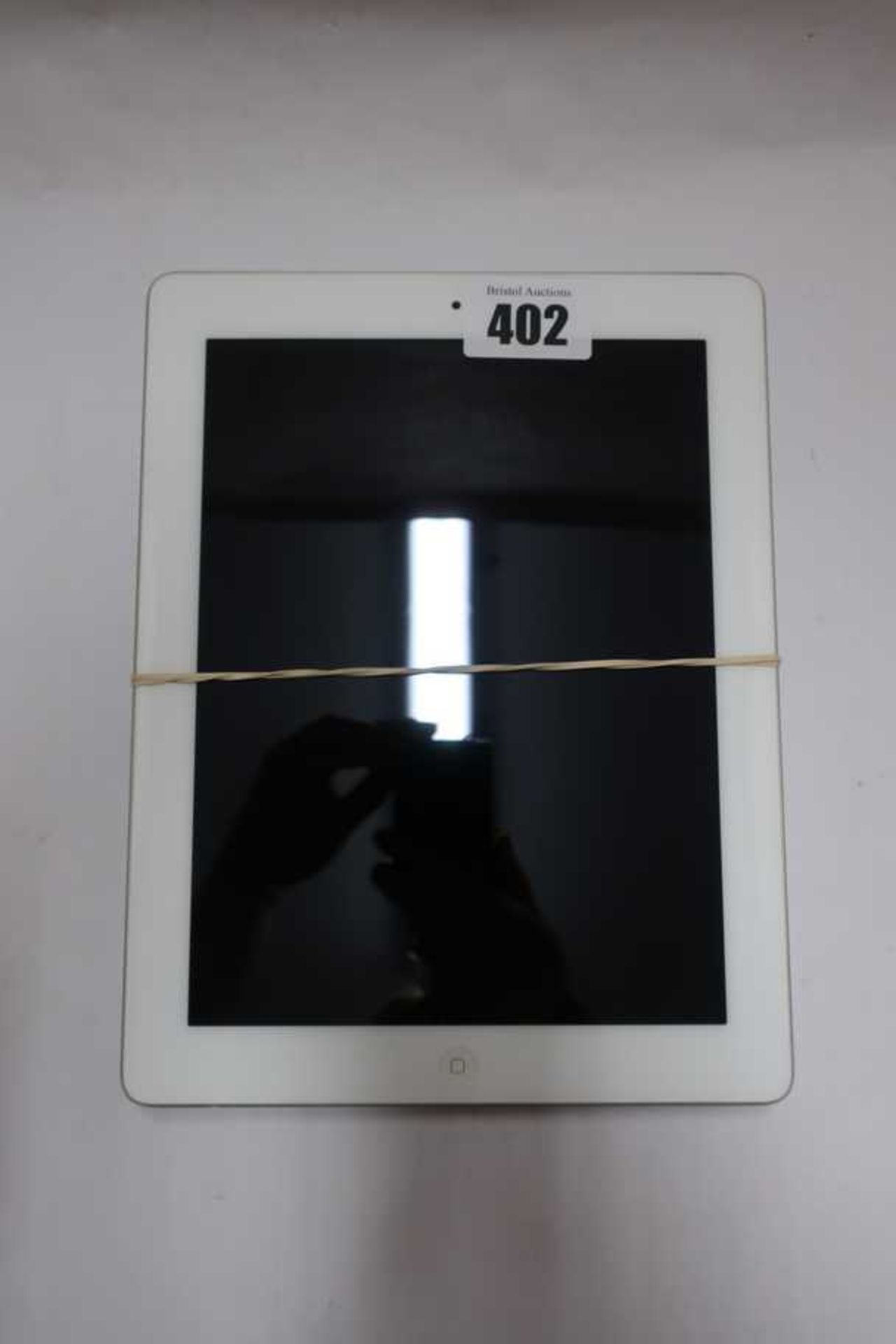 A pre-owned Apple iPad 2 (Wi-Fi Only) A1395 64GB in White (Serial: DN6G2D41DKPK) and an Apple iPad