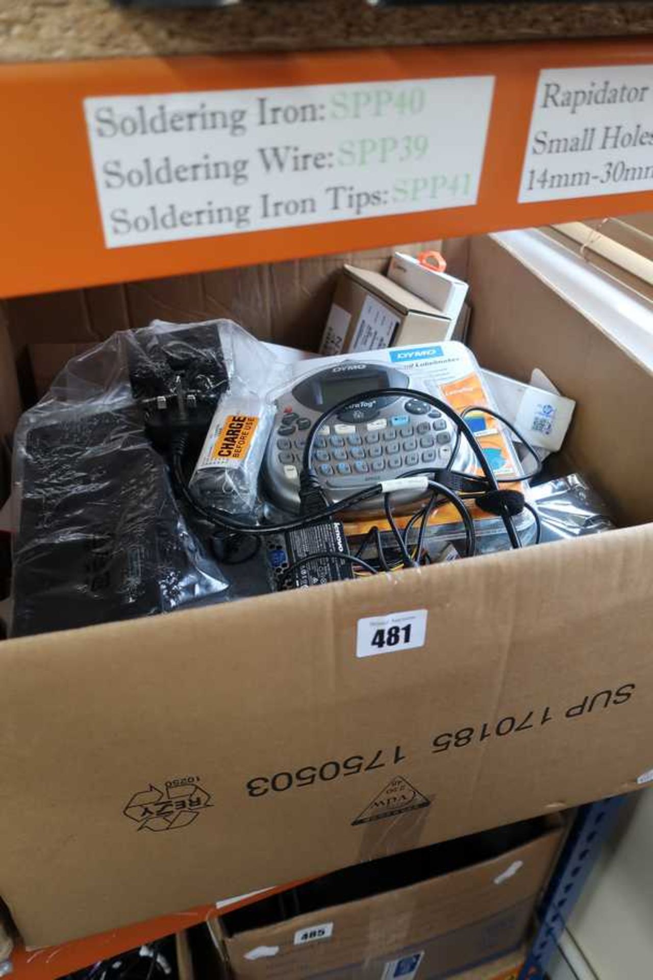 A box of assorted new and pre-owned small electrical items and accessories.