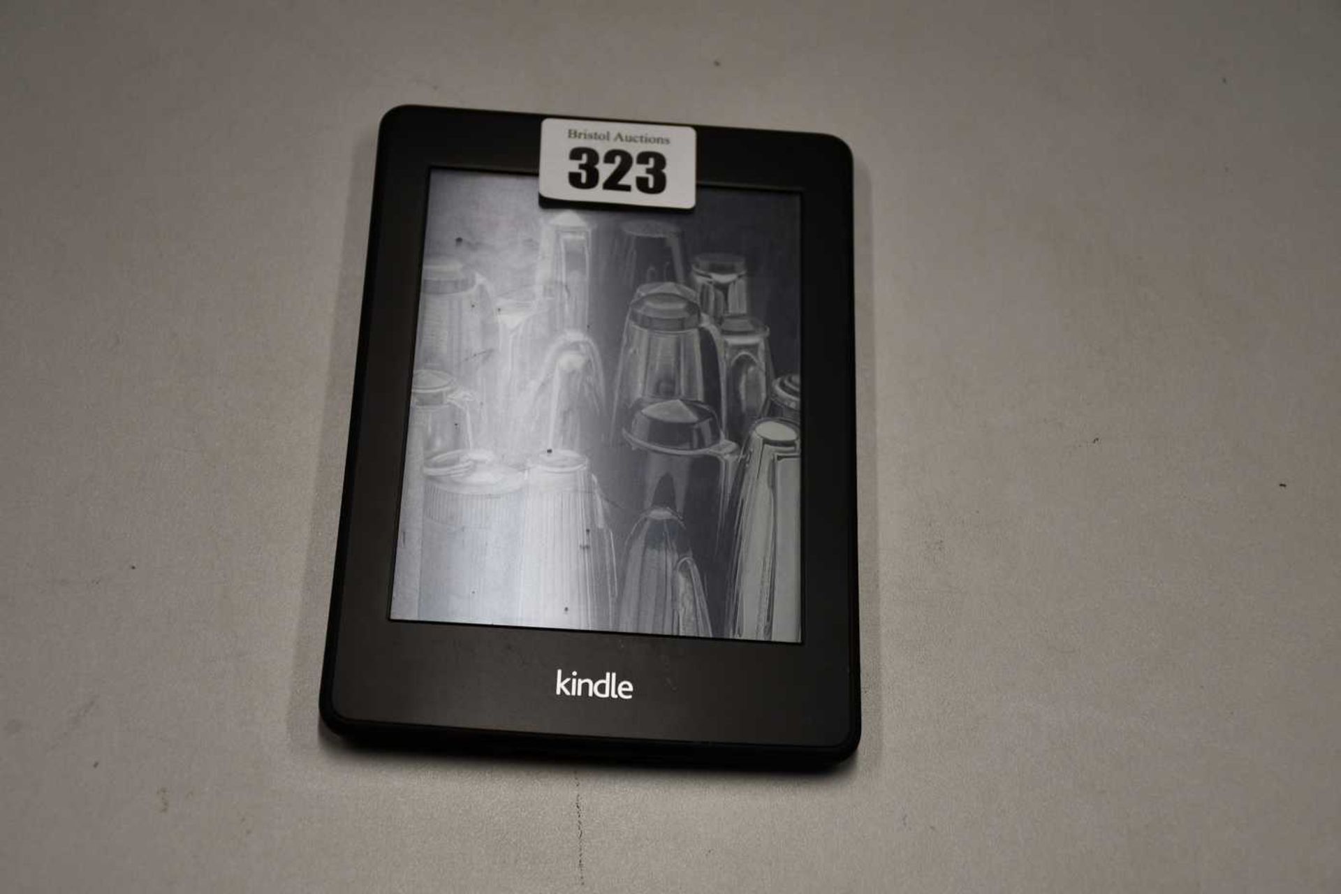 A pre-owned Amazon Kindle Paperwhite (DP75SDI) 6” E-Reader in Black (Slight damage to display).