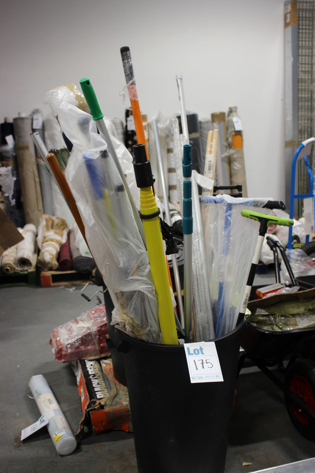 A quantity of assorted hand tools to include a posthole digger.