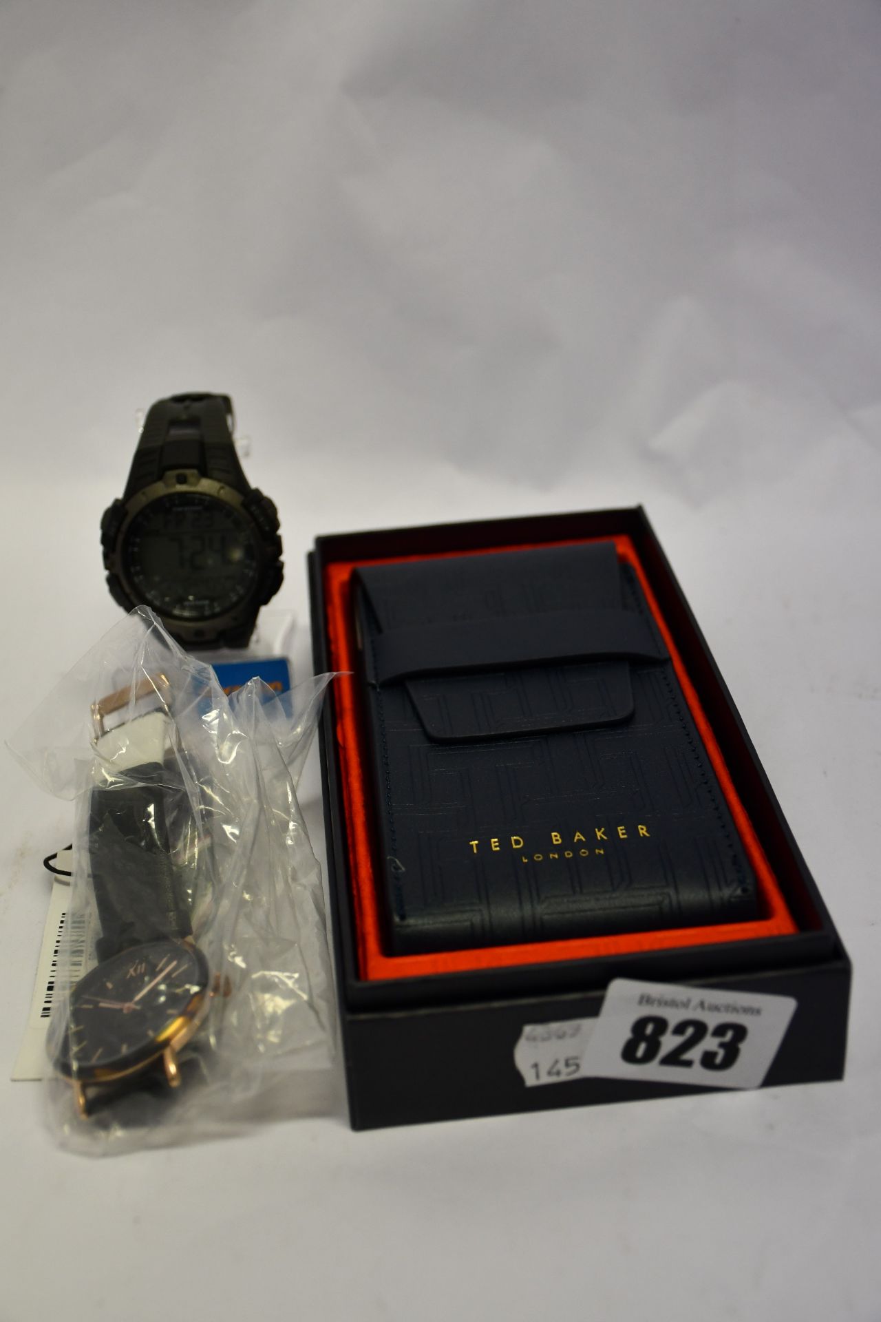 One ladies Ted Baker Phylipa leather watch in black and one man's Timex Marathon watch in black,