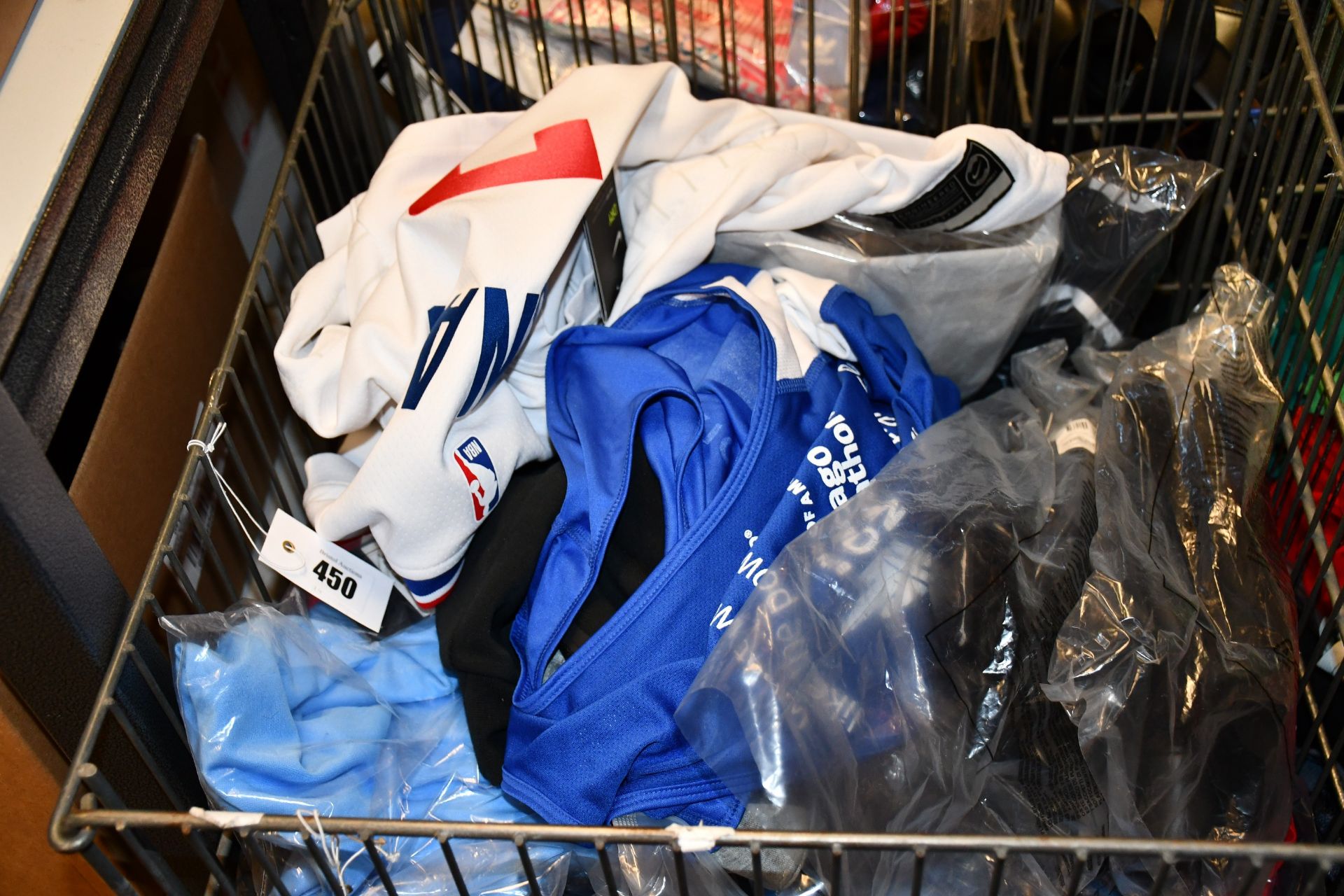A quantity of as new Nike clothing (Basket not included).