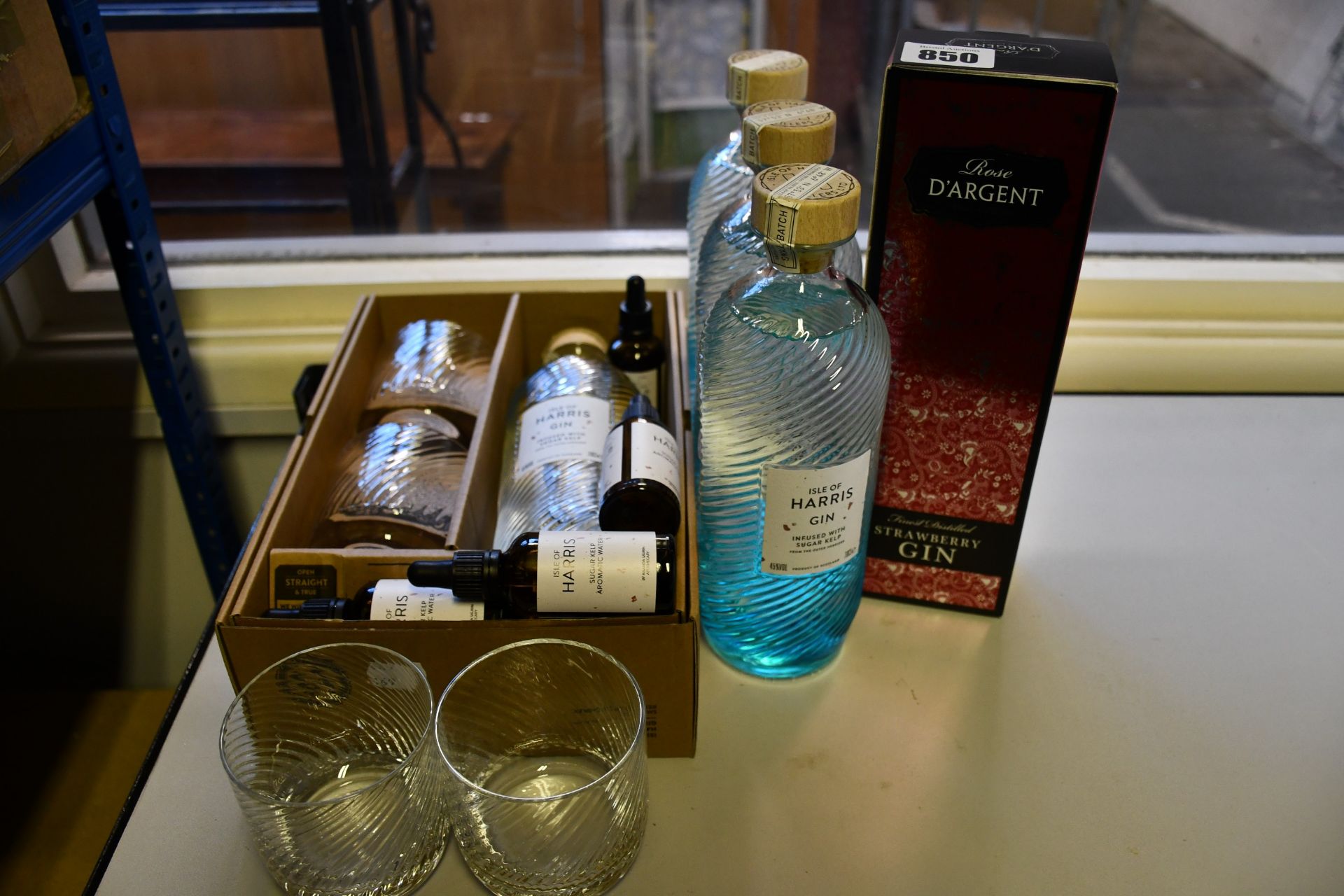 Four bottles of Isle of Harris Gin (70cl) and one bottle of Rose D'argent Strawberry Gin (70cl) (