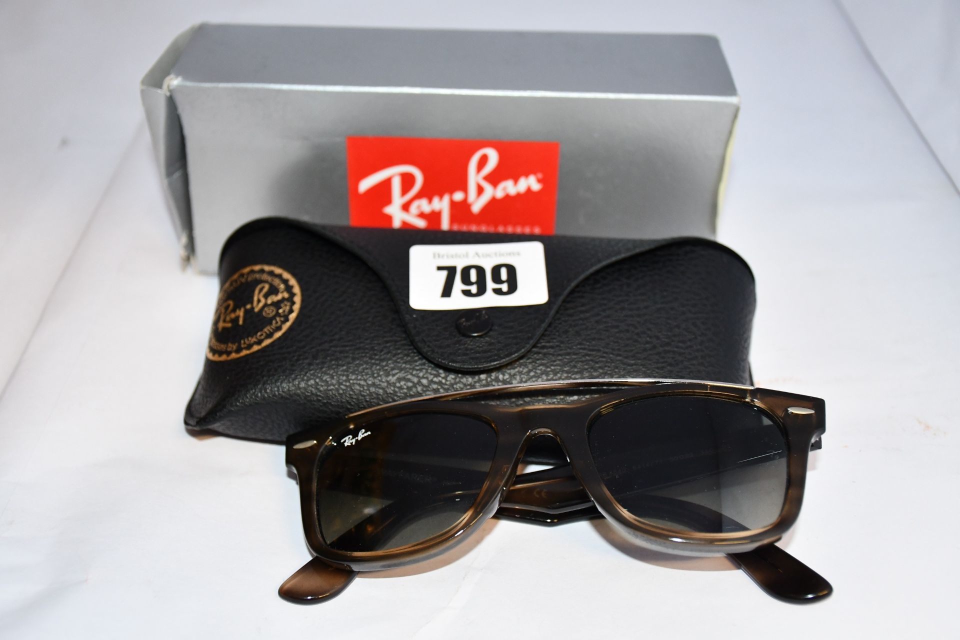 A pair of as new Ray Ban Wayfarer sunglasses.