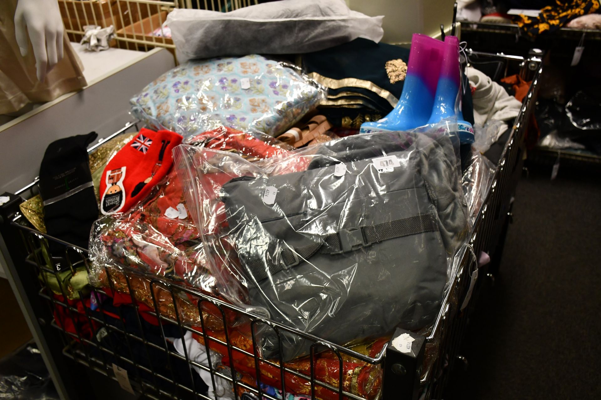 A large basket of assorted as new clothing and related items (Basket not included).