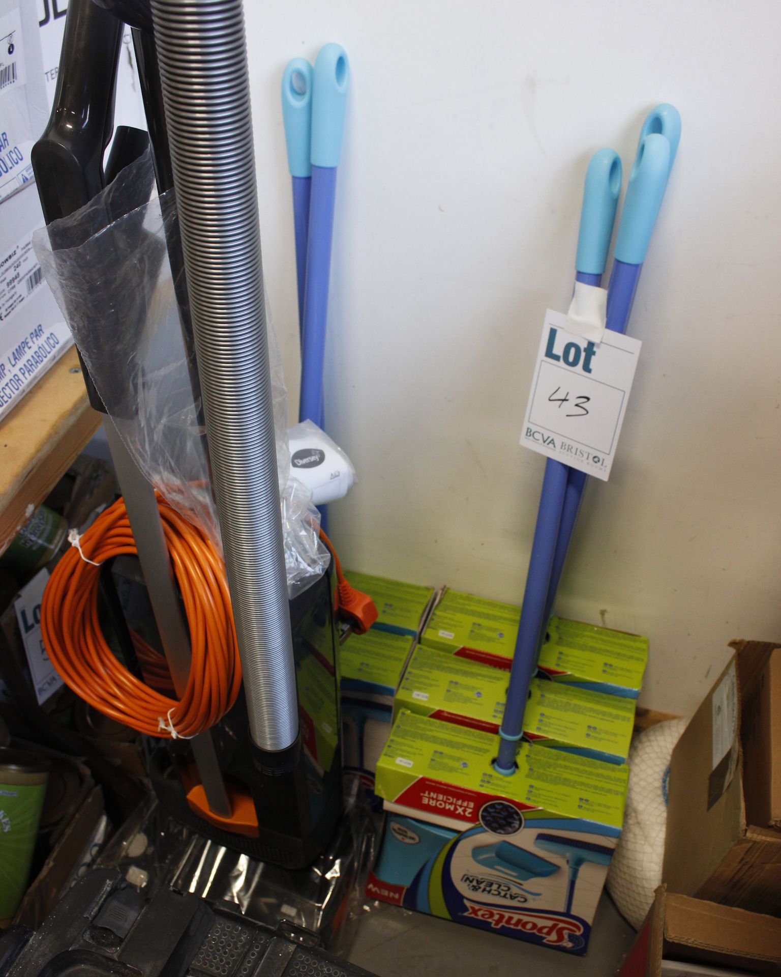 Five Spontex catch and clean dustpan and brush kit and Diversey Ensign 300 EVO vacuum.