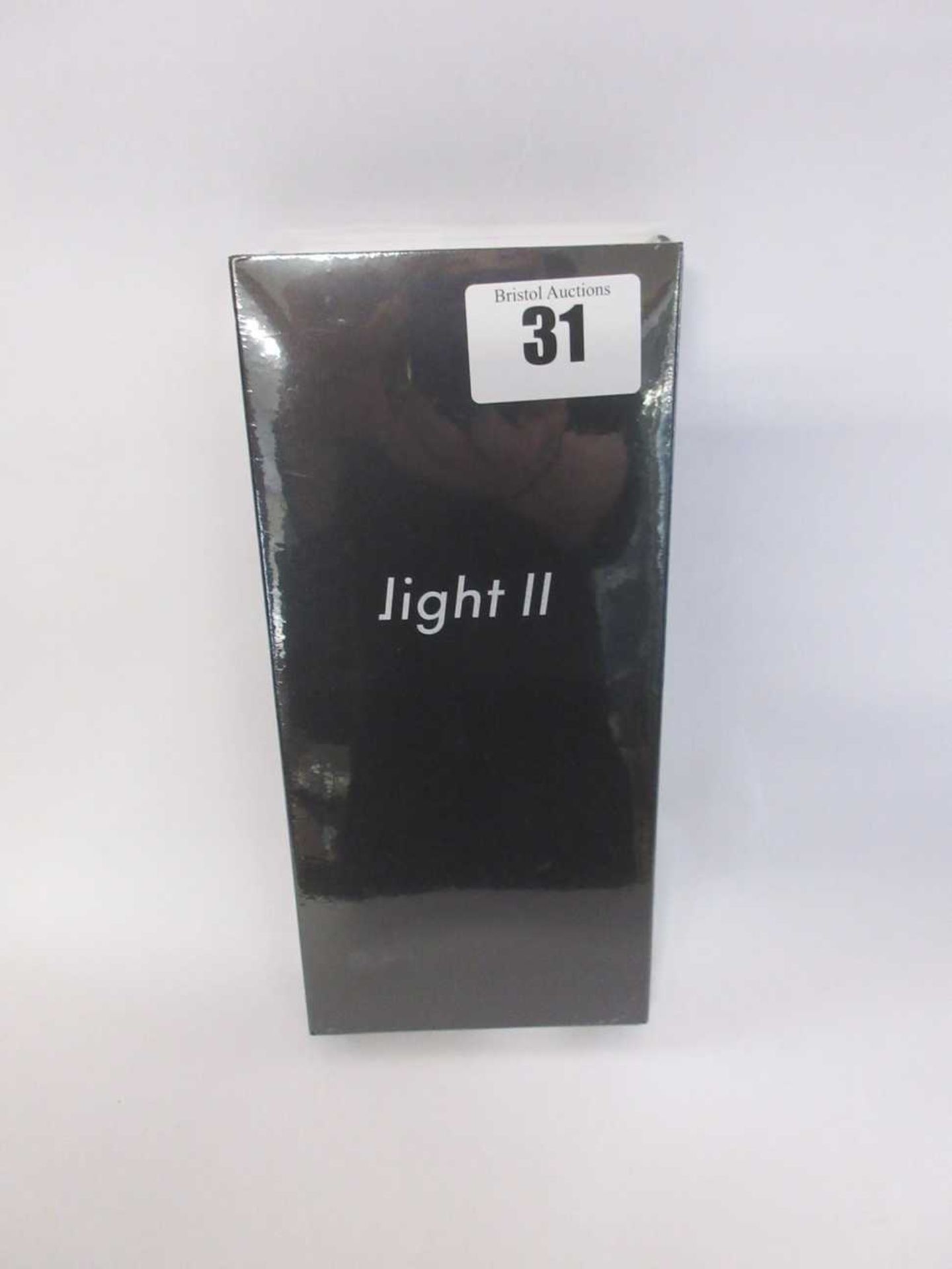 A boxed as new Light Phone 2 TLP202 in Black (IMEI: 352743100100444) (Box sealed).