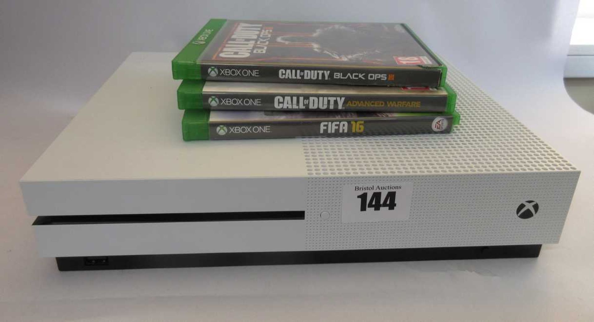 A pre-owned Xbox One S 1681 (Console only) and three pre-owned game disks; Fifa 16, Call of Duty