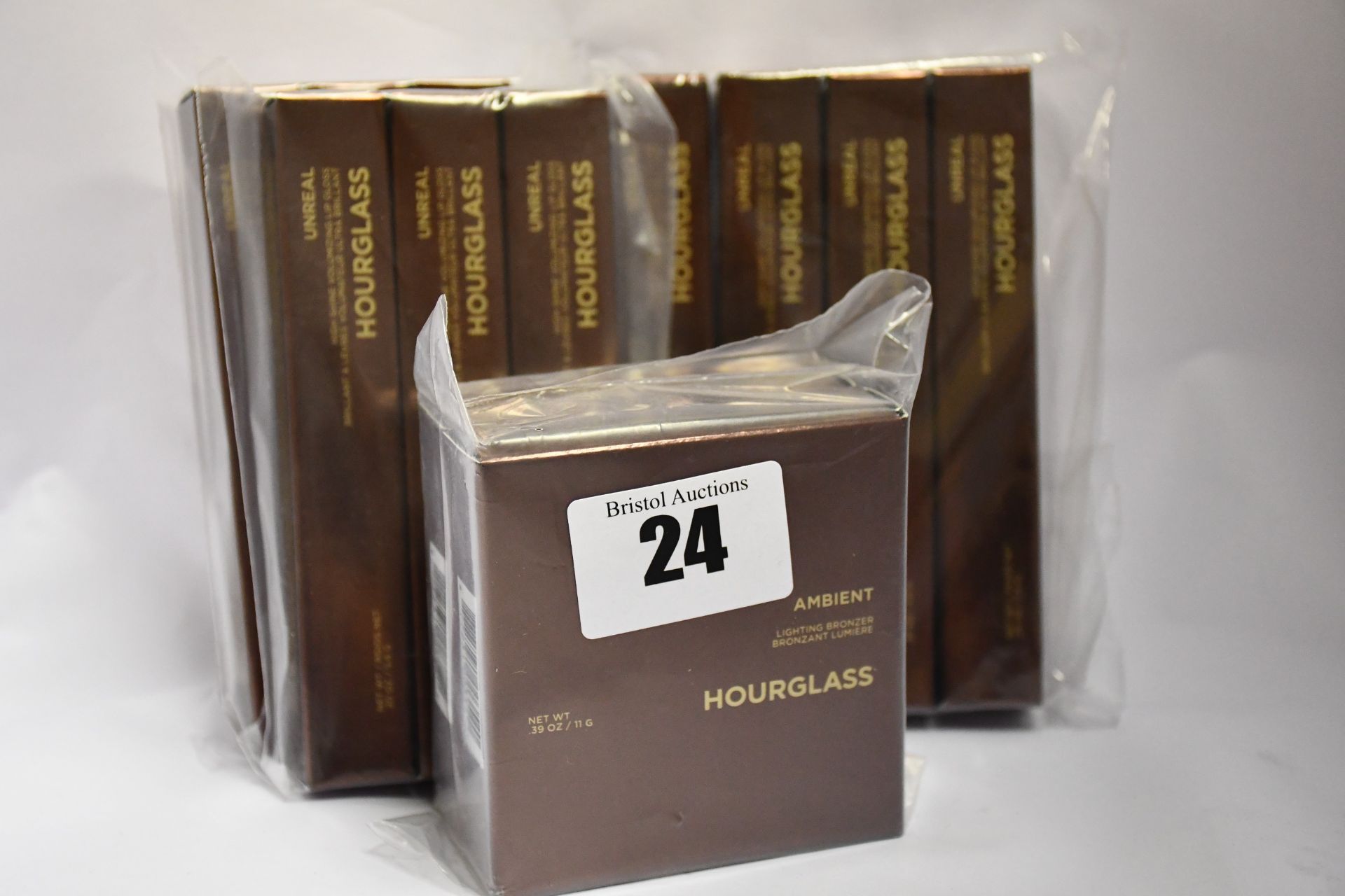 A quantity of boxed as new Hourglass cosmetics to include Unreal high shine volumizing lip gloss (