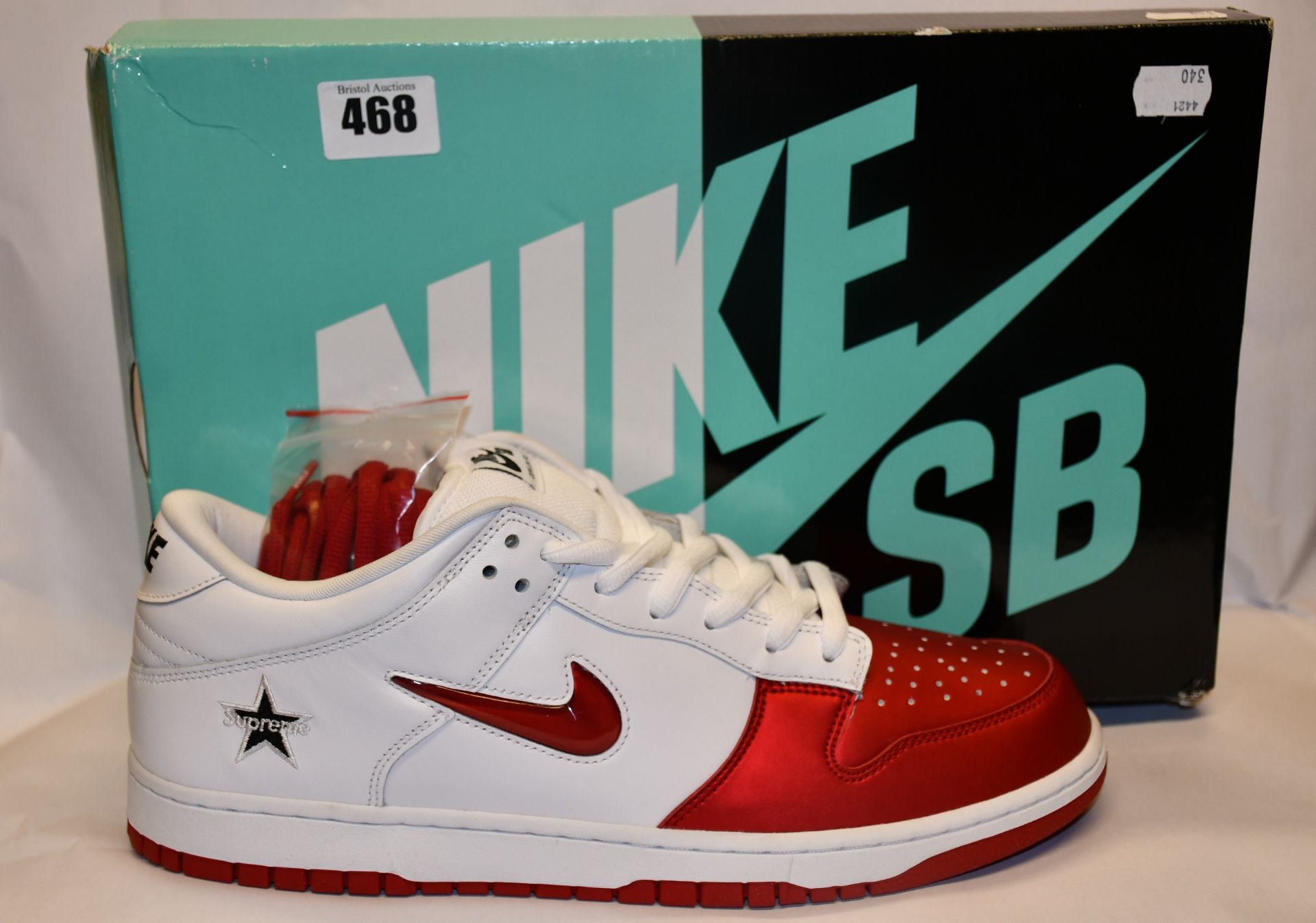 A pair of as new Nike SB Dunk Low OG QS trainers (UK 12).